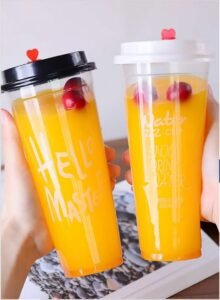 VASOS DE PP CON ZUMO DE NARANJA Y TAPAS RESISTENTES